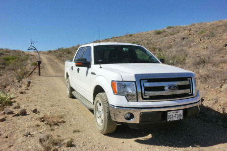 Ford F-150 on dirt road in Texas.